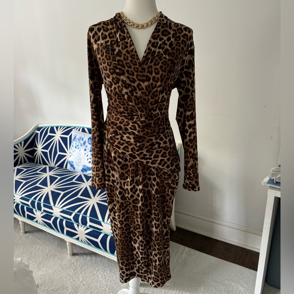 Elegant Joseph Ribkoff faux wrap style knee length leopard print dress.
